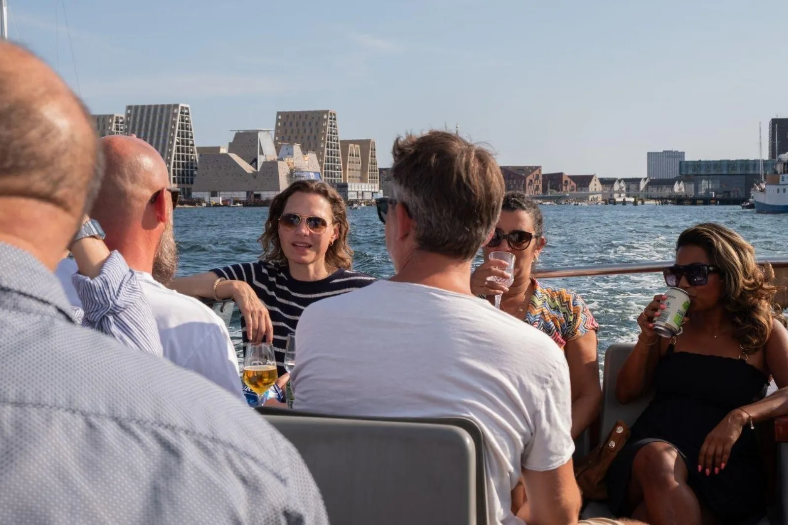 Guests with drinks in the open air on deck