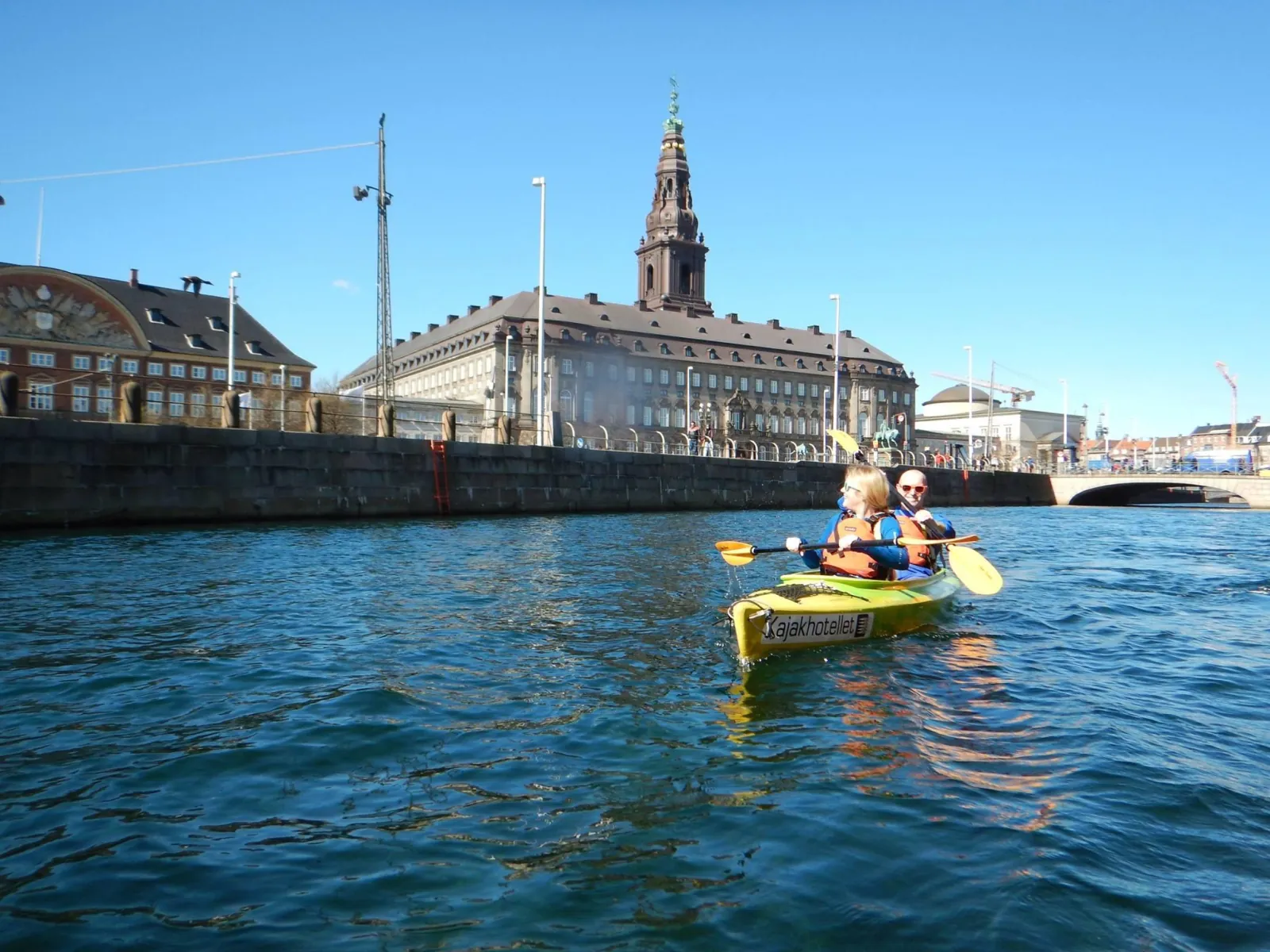 A kayaker below Christiansborg Palace