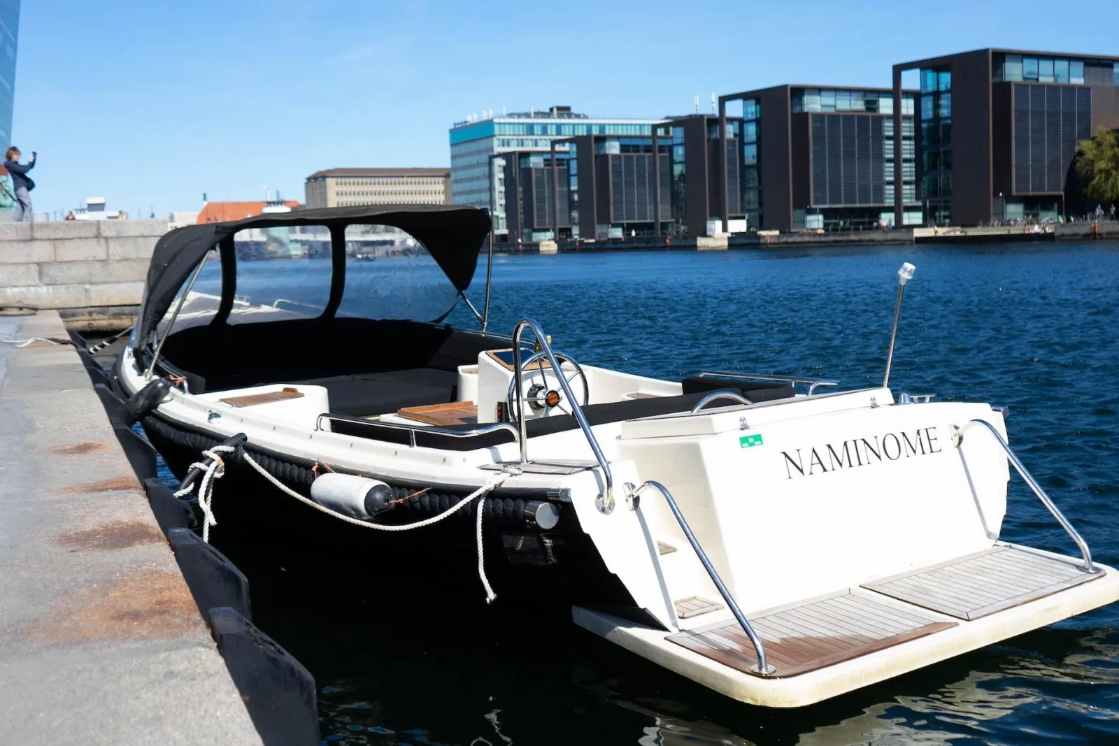 The private boat moored at a harbourfront jetty